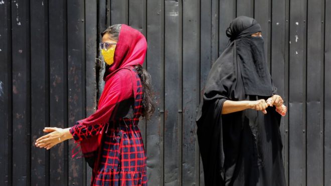 Sri Lankan ethnic Muslim women wait in a queue for the Covid-19 blood test in Colombo, Sri Lanka, 04 May 2020
